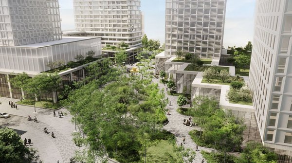 Aerial view of a modern urban district with several towers surrounding a large green landscaped area with pedestrian pathways. The image illustrates sustainable design blending nature and architecture.